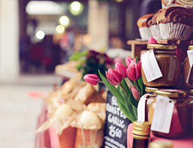 cakes and flowers at a market