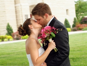 single man and single women kissing on wedding day